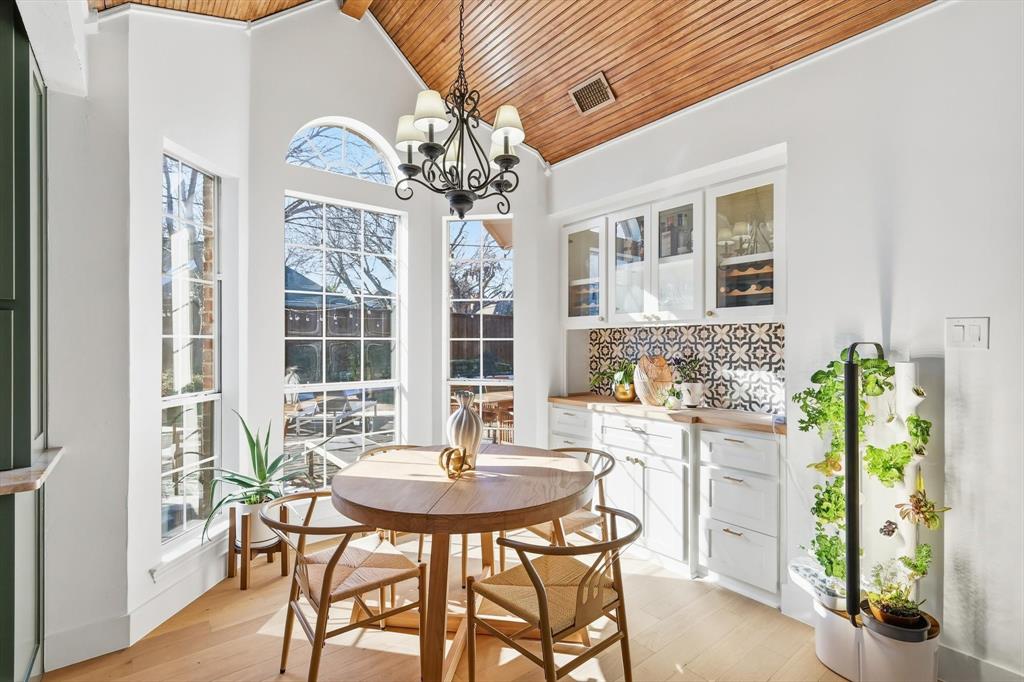 117 Sand Point Court Coppell, TX 75019 - Photo 17 of 40 a view of a dining room with furniture and chandelier