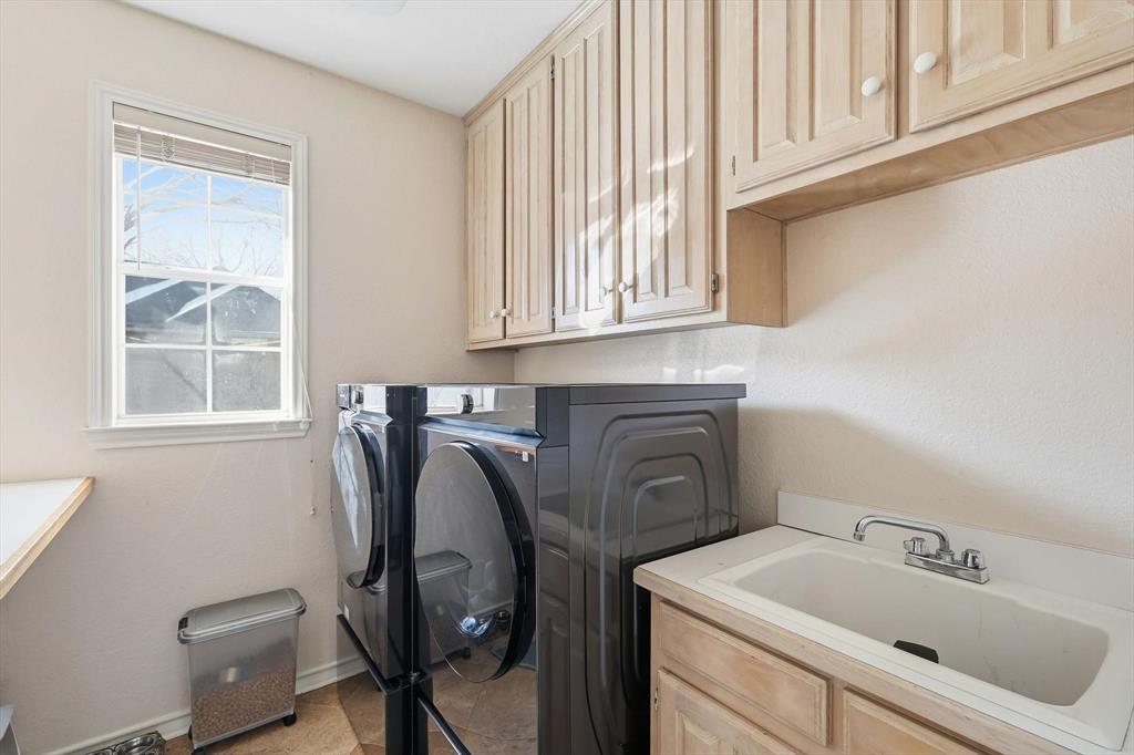 117 Sand Point Court Coppell, TX 75019 - Photo 23 of 40 a utility room with sink dryer and washer