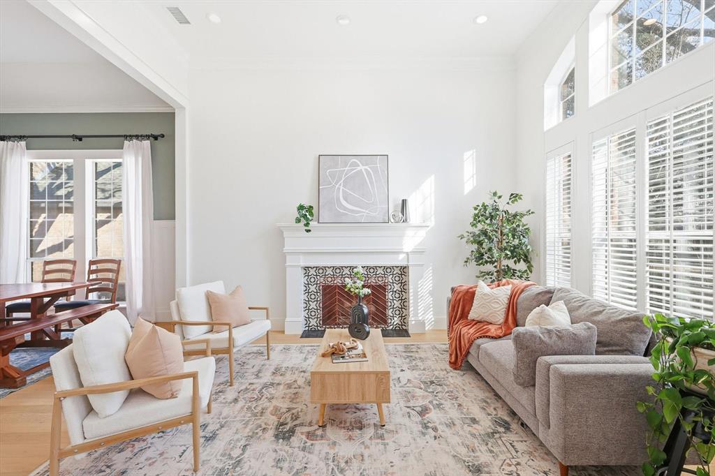117 Sand Point Court Coppell, TX 75019 - Photo 4 of 40 a living room with furniture fireplace and a large window