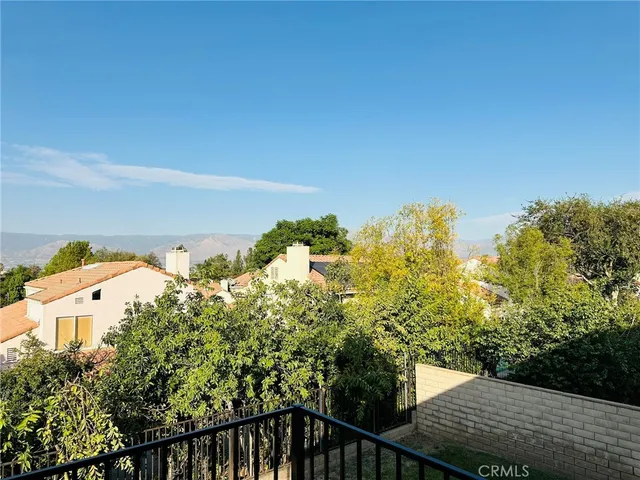 a balcony with an outdoor space