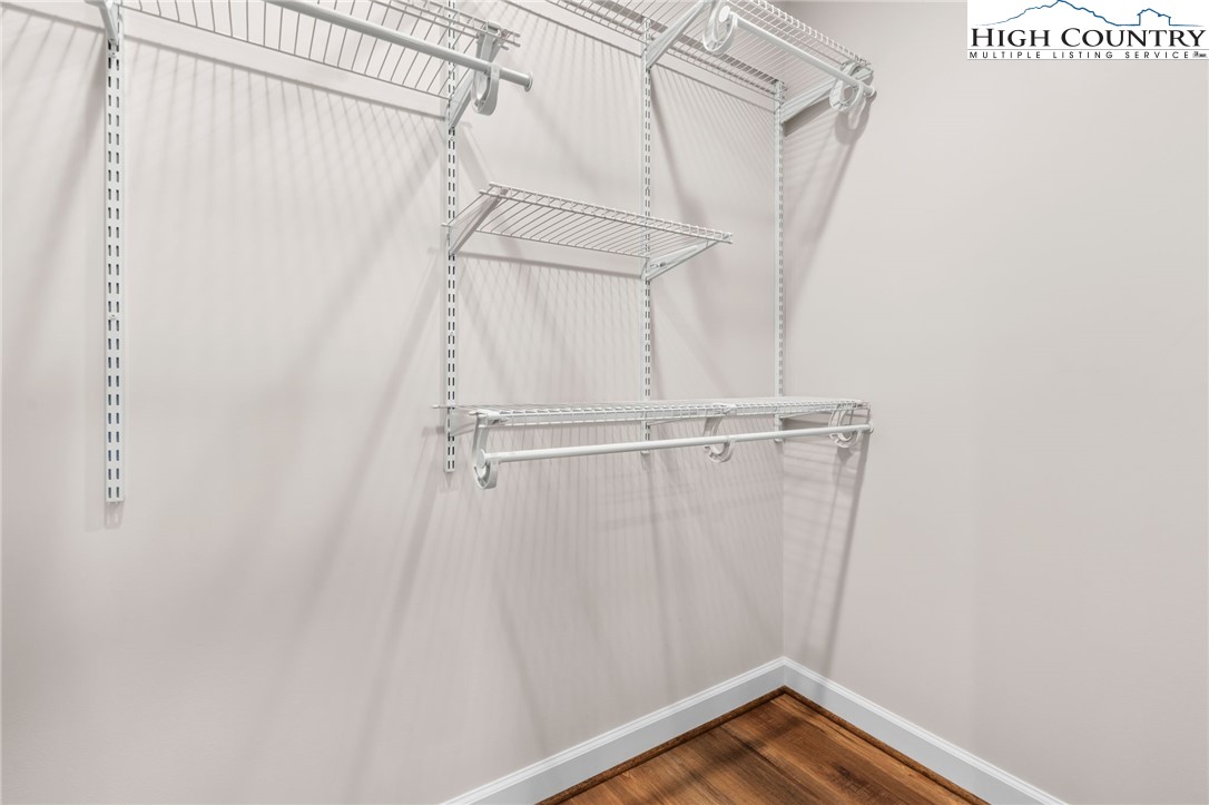 245 Ava Way, Unit 108 Boone, NC 28607 - Photo 20 of 31 a view of walk in closet with empty racks