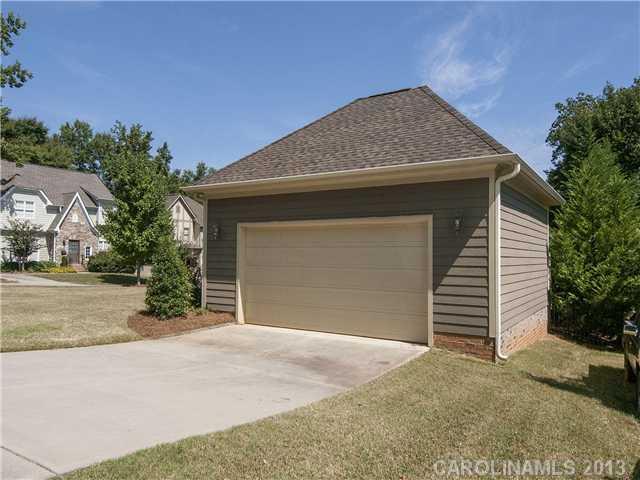 810 Millbrook Road Charlotte, NC 28211 - Photo 15 of 16 a front view of a house with a yard and garage