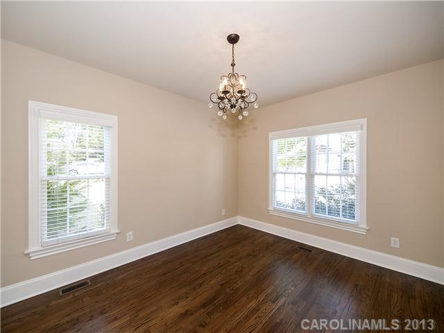 810 Millbrook Road Charlotte, NC 28211 - Photo 6 of 16 a view of an empty room with wooden floor and a window