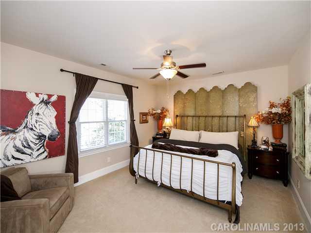 810 Millbrook Road Charlotte, NC 28211 - Photo 7 of 16 a bedroom with furniture and a large window