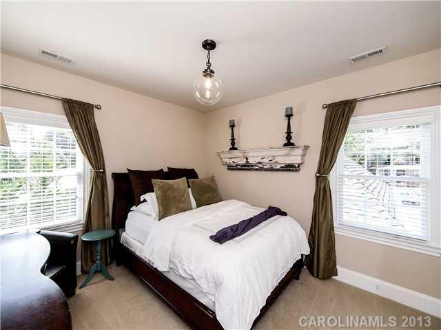 810 Millbrook Road Charlotte, NC 28211 - Photo 10 of 16 a bedroom with bed and window