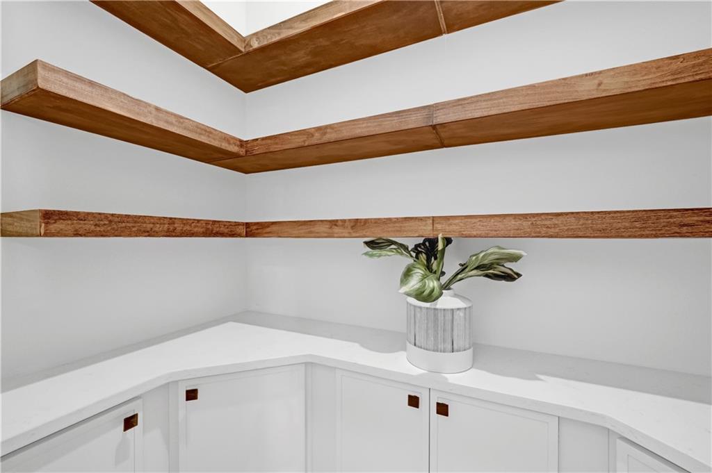 2893 Lavista Road Decatur, GA 30033 - Photo 13 of 37 a vase of flowers sitting on a shelf