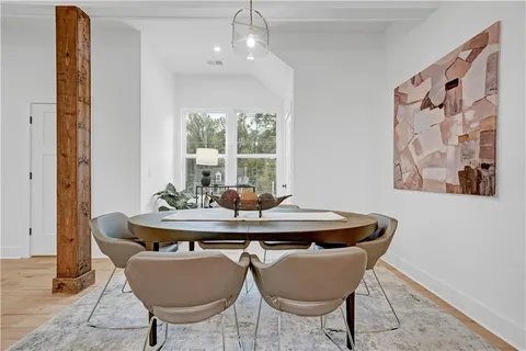 a dining room with furniture and window