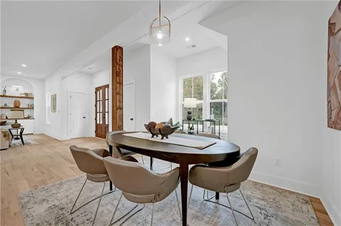 a view of a dining room with furniture and window