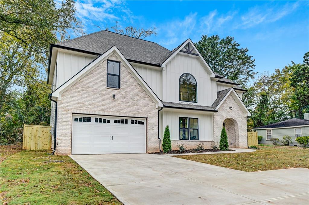 2893 Lavista Road Decatur, GA 30033 - Photo 2 of 37 a front view of a house with a yard and garage
