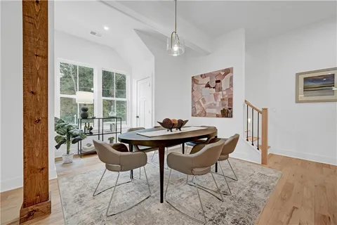 a view of a dining room with furniture window and outside view