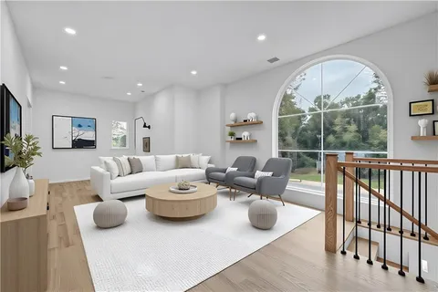 a living room with furniture and a large window