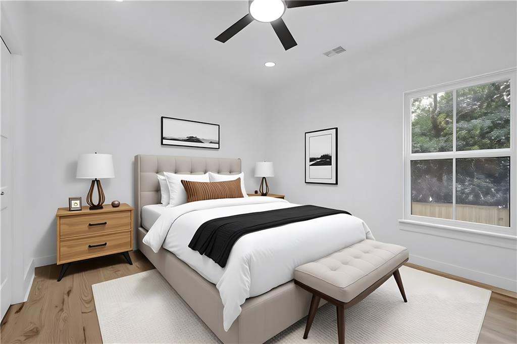 2893 Lavista Road Decatur, GA 30033 - Photo 28 of 37 a bedroom with a bed and a large window