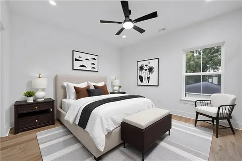 a bedroom with a bed and a desk