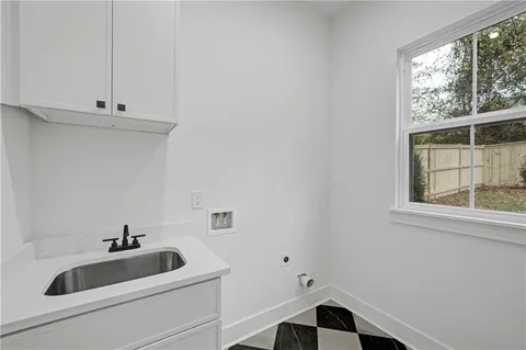 a bathroom with a sink and a window