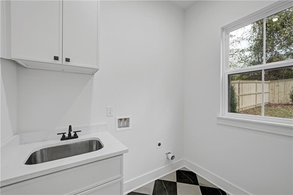 2893 Lavista Road Decatur, GA 30033 - Photo 34 of 37 a bathroom with a sink and a window