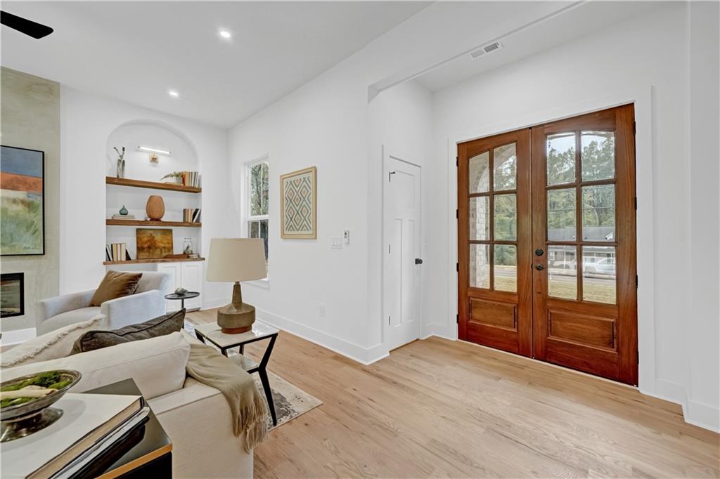 2893 Lavista Road Decatur, GA 30033 - Photo 6 of 37 a living room with furniture a rug and a window