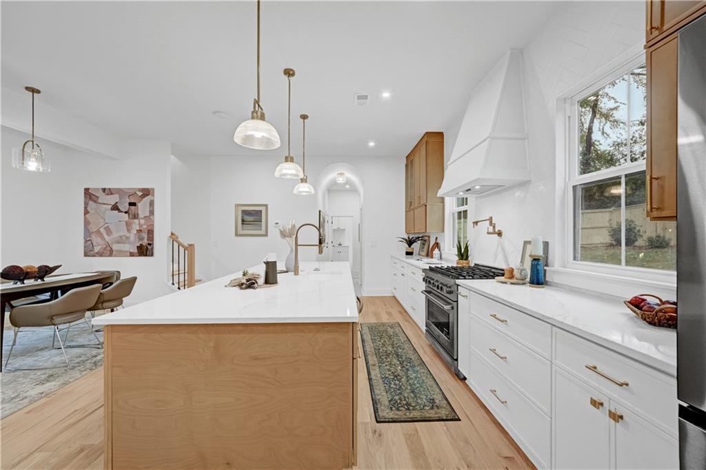 2893 Lavista Road Decatur, GA 30033 - Photo 9 of 37 a large kitchen with granite countertop a sink a counter space appliances and cabinets