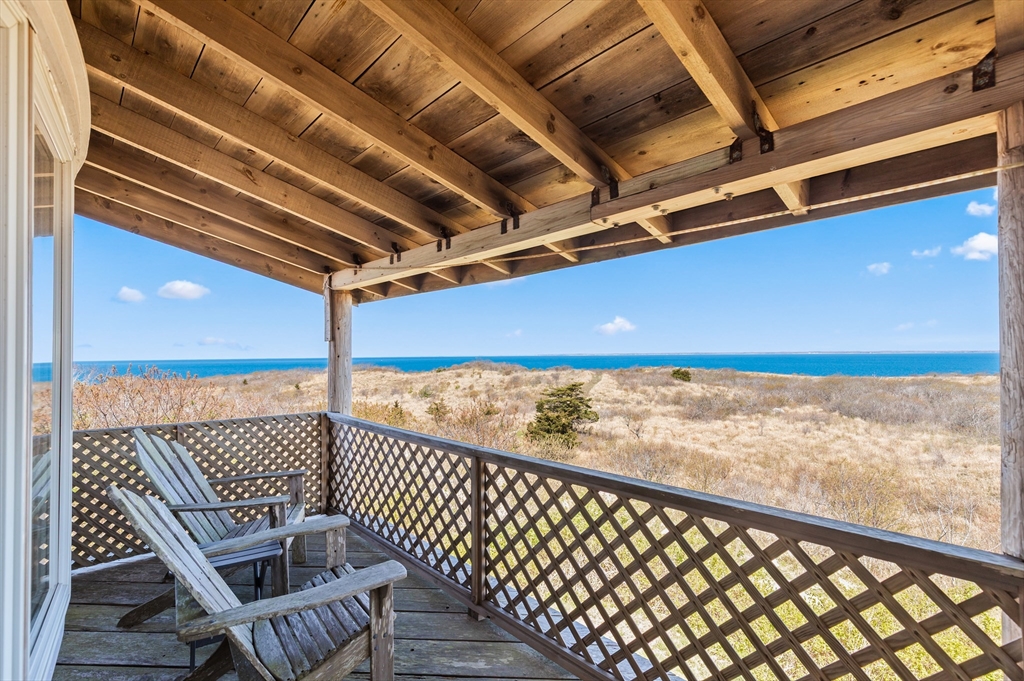0 Bayberry Hill Road Cuttyhunk, MA 02713 - Photo 4 of 12 a view of balcony with wooden floor