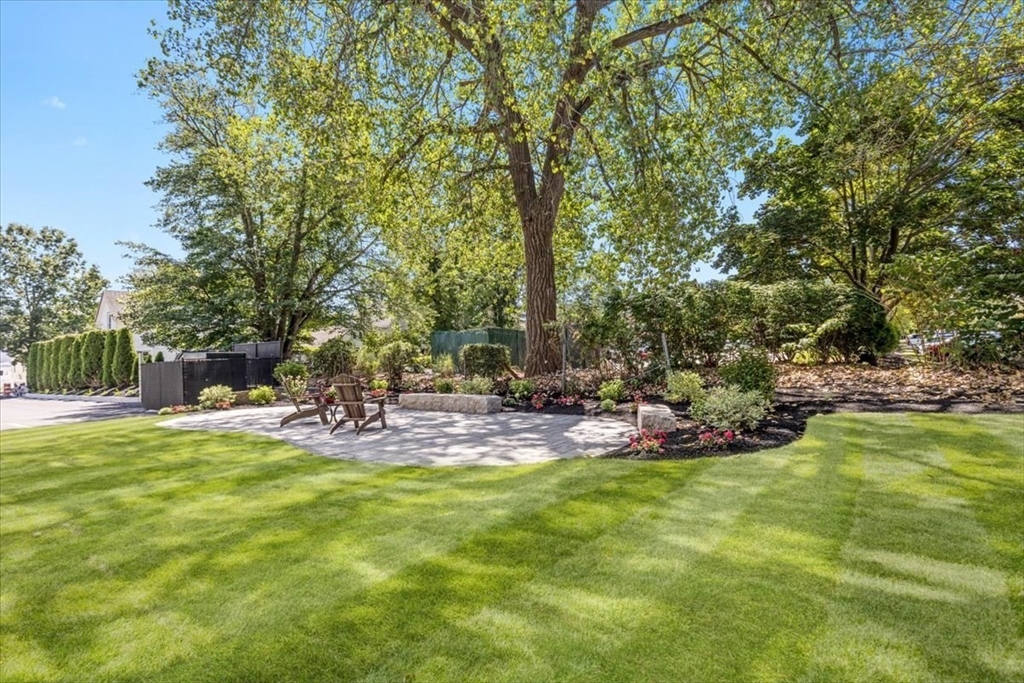21 Totman Street, Unit MODEL1 Quincy, MA 02169 - Photo 13 of 14 a view of a patio with a tree