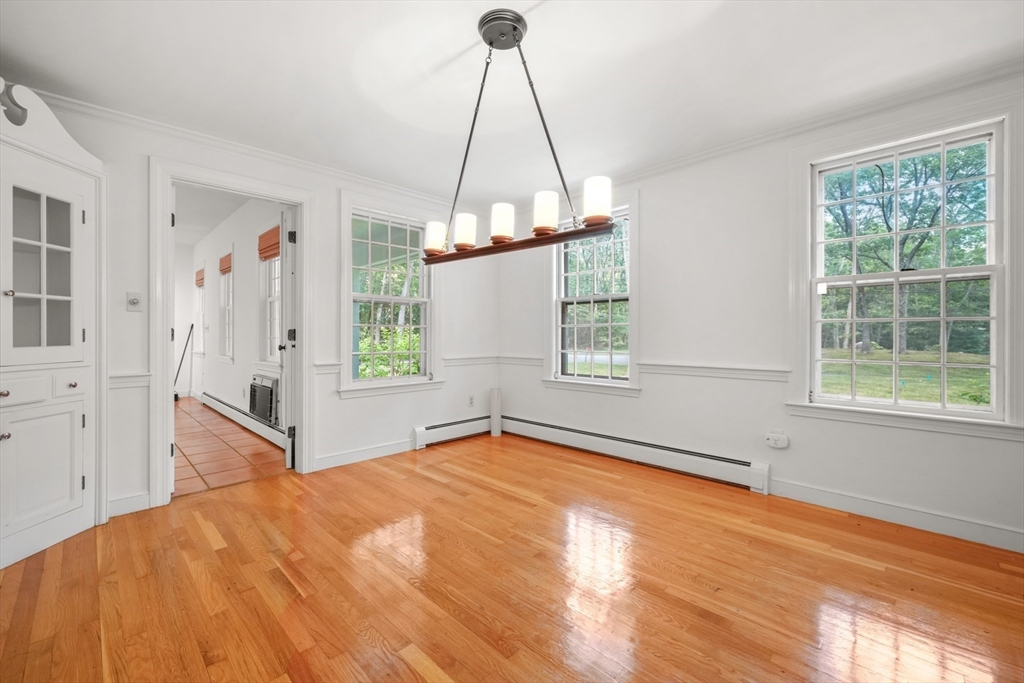 188 Country Drive, Unit 188 Weston, MA 02493 - Photo 6 of 21 a view of a livingroom with wooden floor and a window