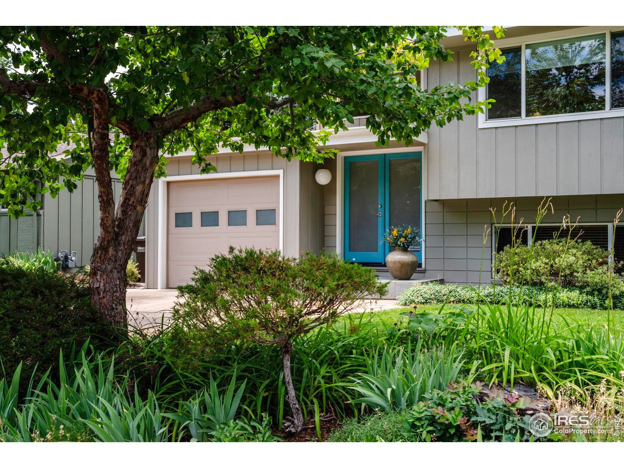 3555 Cloverleaf Drive Boulder, CO 80304 - Photo 1 of 31 a view of a house with a yard and potted plants