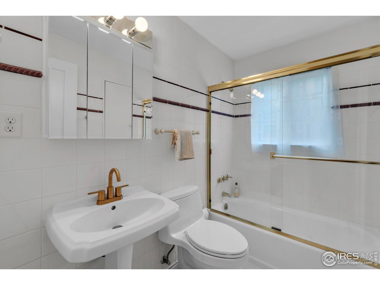 3555 Cloverleaf Drive Boulder, CO 80304 - Photo 17 of 31 a bathroom with a sink toilet a mirror and shower