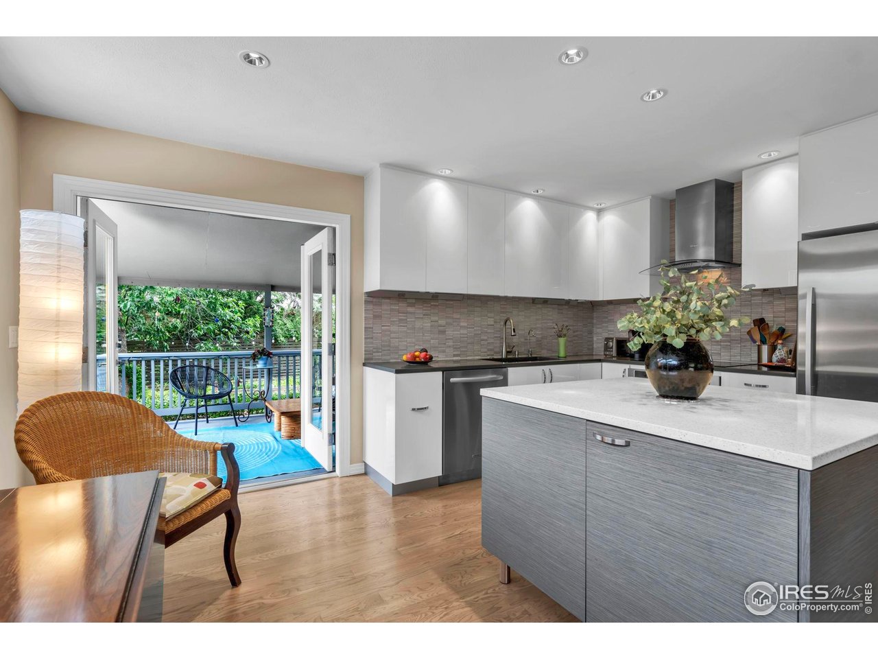 3555 Cloverleaf Drive Boulder, CO 80304 - Photo 4 of 31 a kitchen with stainless steel appliances granite countertop a sink cabinets and wooden floor