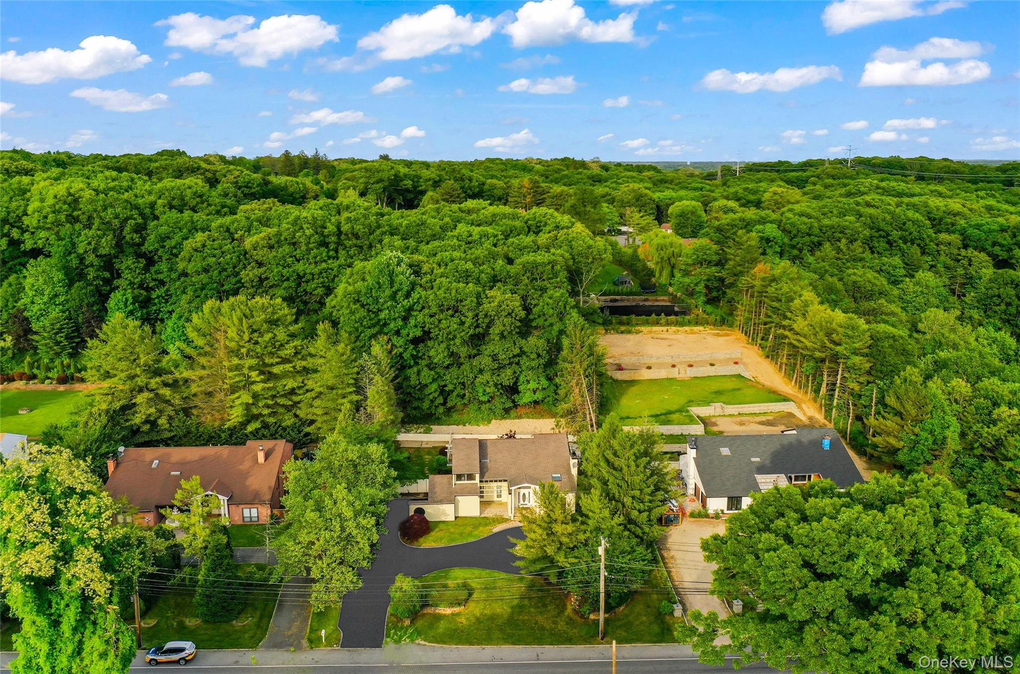 126 Bagatelle Road Melville, NY 11747 - Photo 46 of 50 a view of an outdoor space and a yard