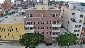 an aerial view of multi story residential apartment building