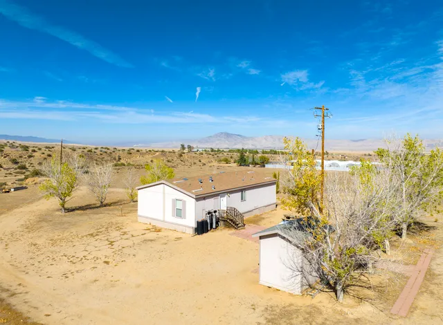 a view of a ocean with a building in the background