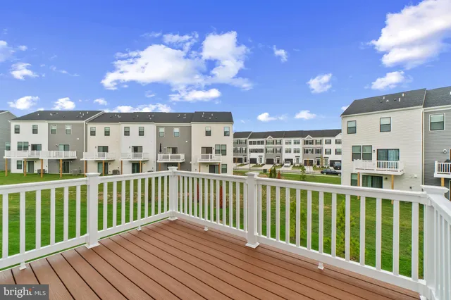a view of balcony with wooden floor