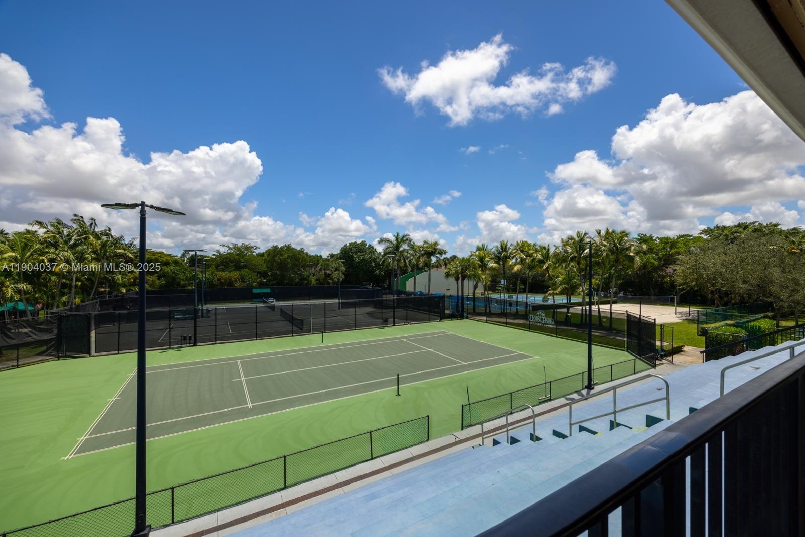 9725 Northwest 52nd Street, Unit 415 Doral, FL 33178 - Photo 17 of 24 a view of a tennis court
