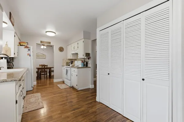 a view of a livingroom with furniture and wooden floor
