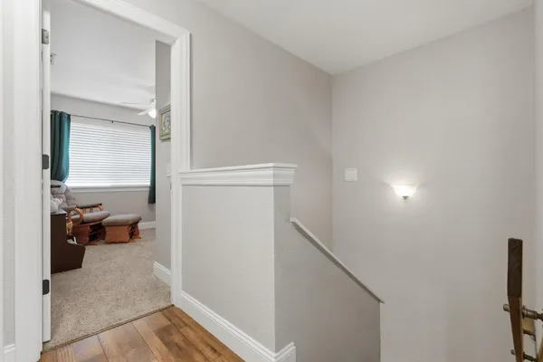 a view of a livingroom with furniture and windows