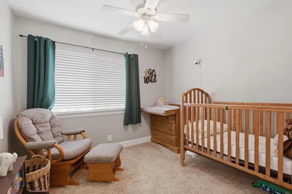 a view of a livingroom with furniture and stairs