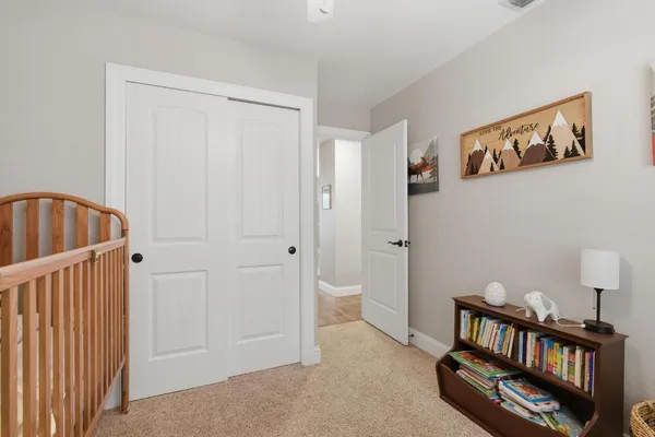 a bedroom with a bed and a table in it