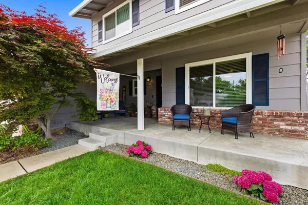 a view of a backyard with swimming pool