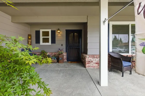 a view of front door with wooden floor and stairs
