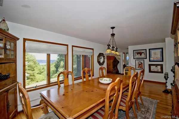 a dining room with furniture and window