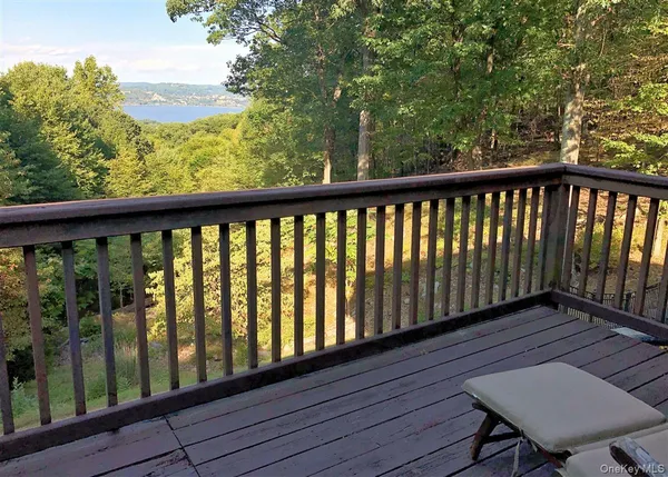 a view of a balcony with wooden floor