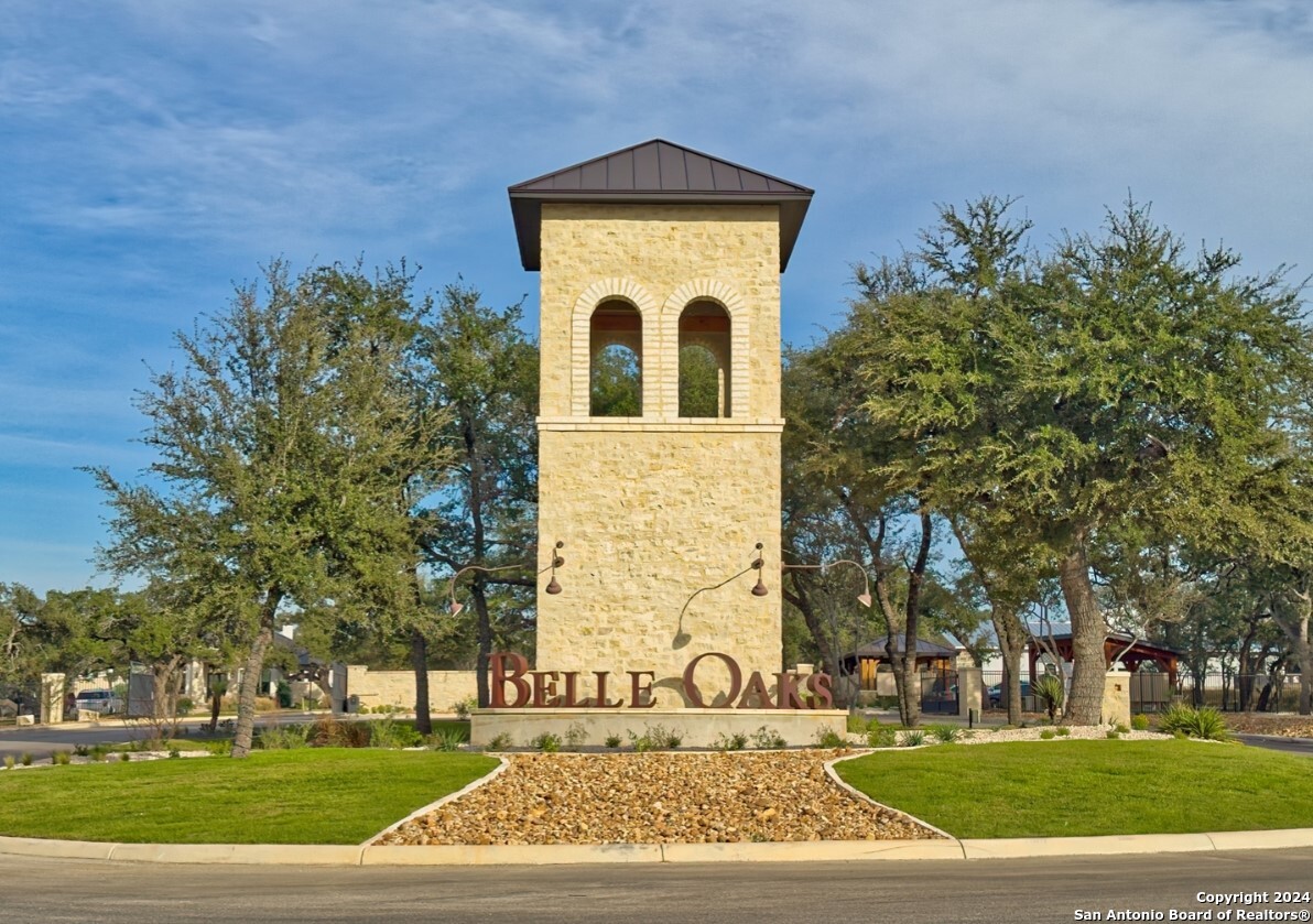 755 Maximino Ridge Bulverde, TX 78163 - Photo 1 of 14 front view of a brick house with a yard
