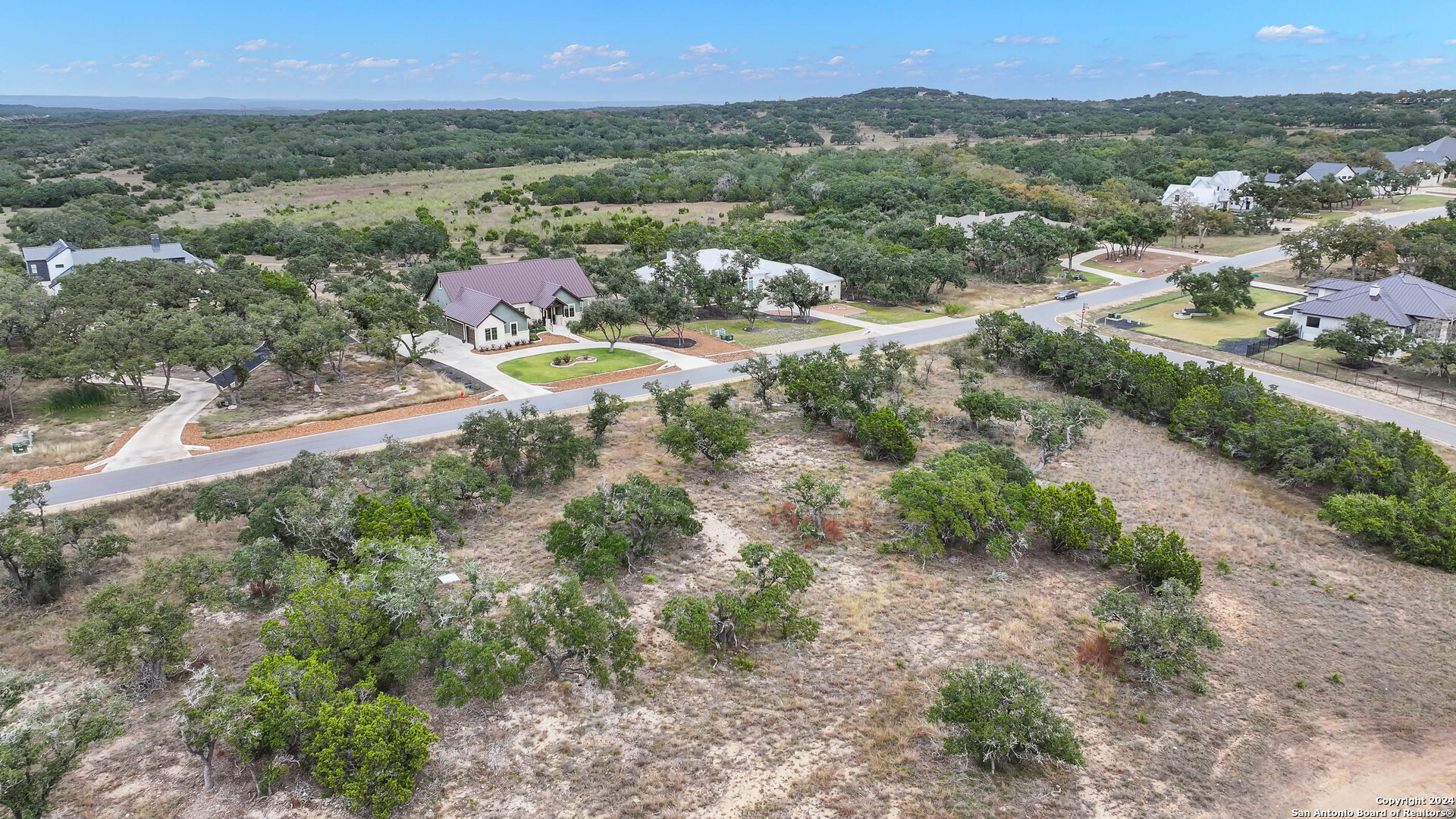755 Maximino Ridge Bulverde, TX 78163 - Photo 3 of 14 an aerial view of residential houses with outdoor space and trees