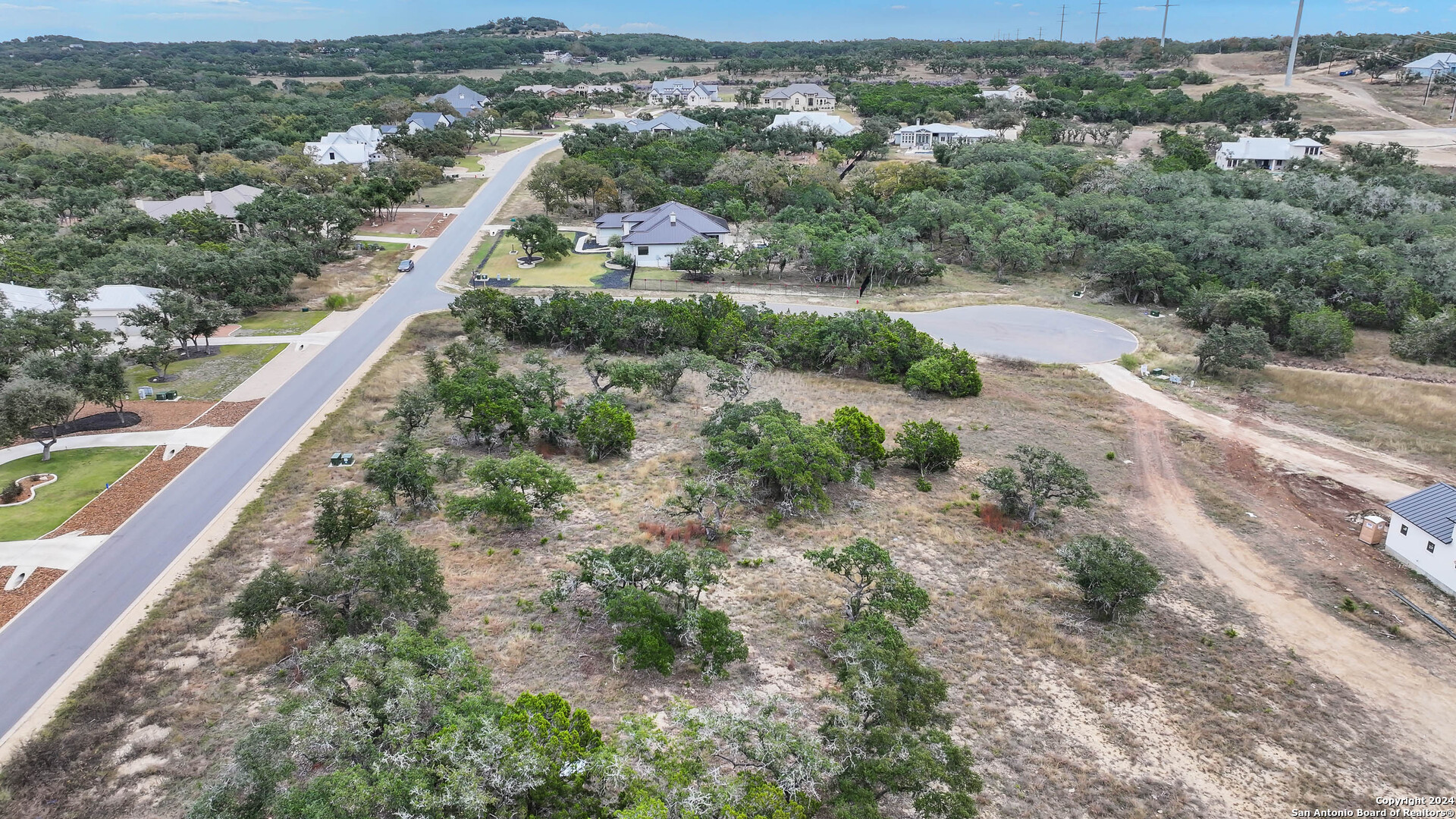 755 Maximino Ridge Bulverde, TX 78163 - Photo 8 of 14 an aerial view of residential houses with outdoor space and trees