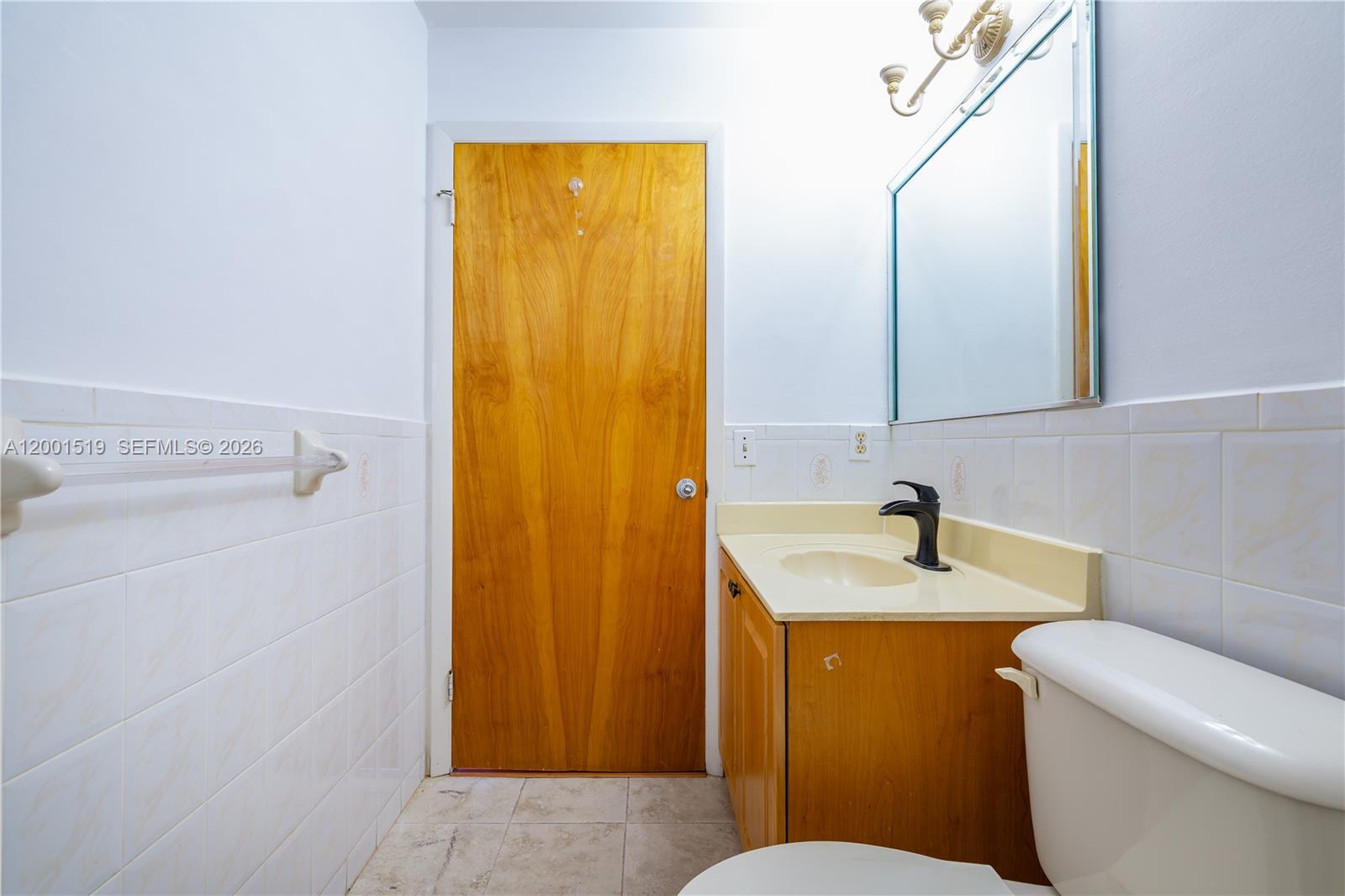10017 West Okeechobee Road, Unit 202 Hialeah Gardens, FL 33016 - Photo 21 of 30 a bathroom with a sink and a toilet