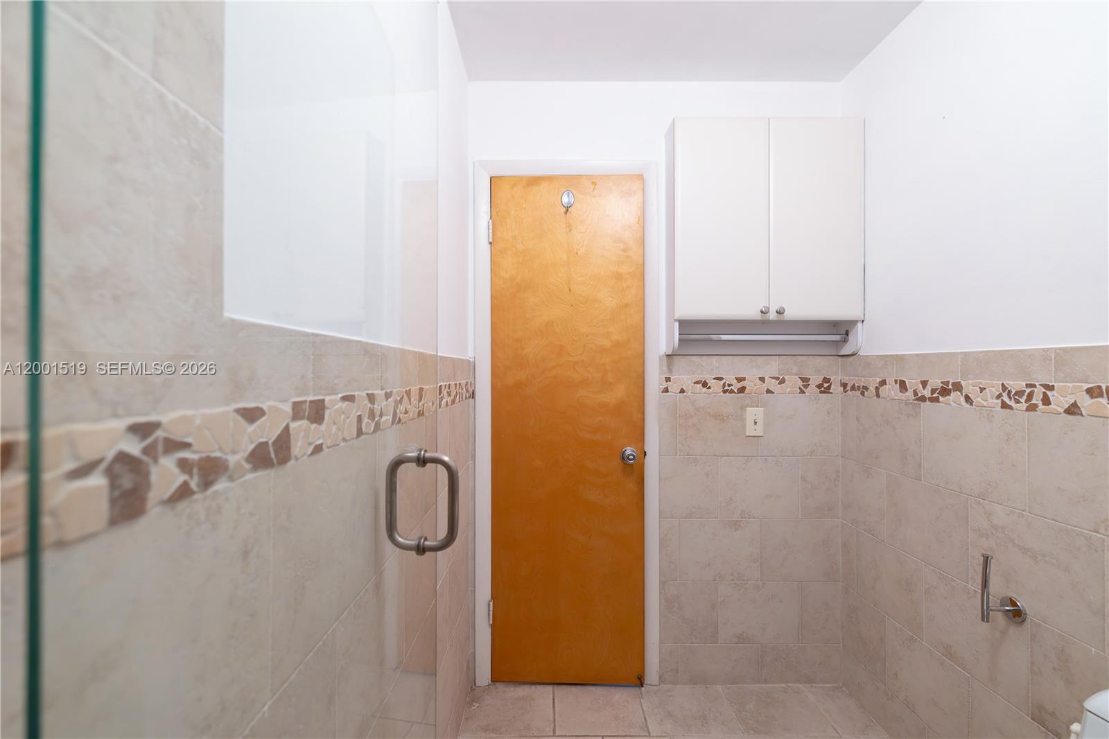 10017 West Okeechobee Road, Unit 202 Hialeah Gardens, FL 33016 - Photo 28 of 30 a bathroom with a granite countertop shower and a sink