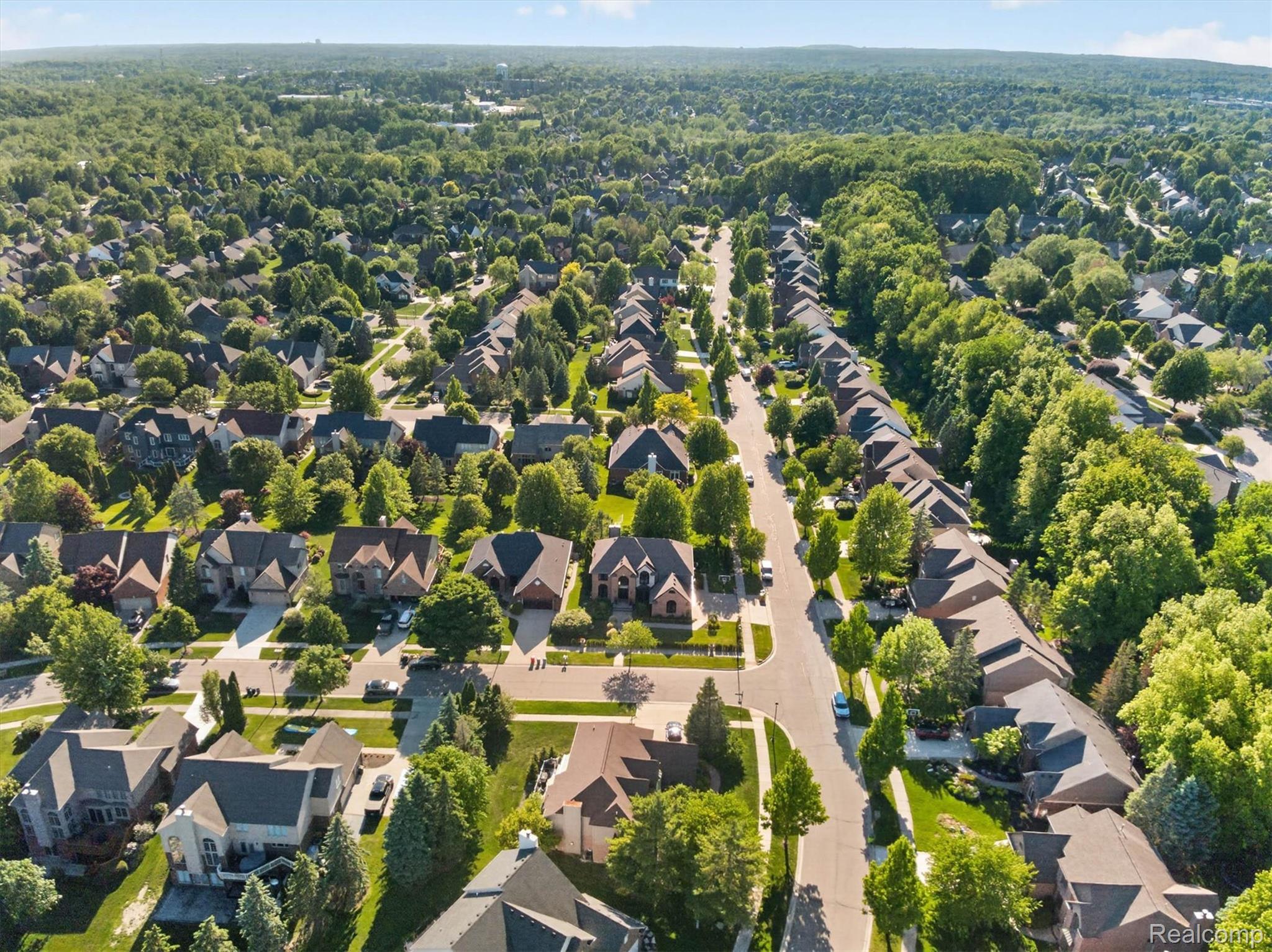 371 Lone Pine Circle Rochester, MI 48307 - Photo 58 of 59 Aerial perspective showcasing a residential area with extensive tree coverage