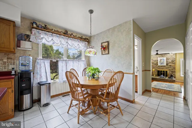 a dining room with furniture and chandelier