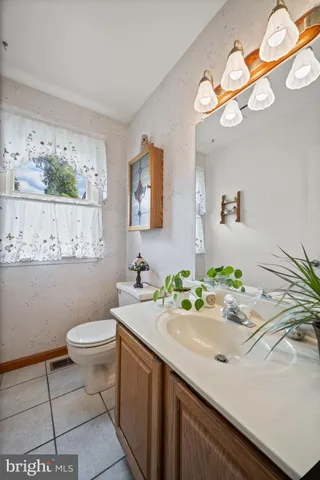 a room with wooden floors and stairs