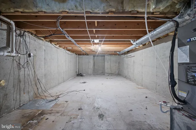 a bedroom with a bed and a television