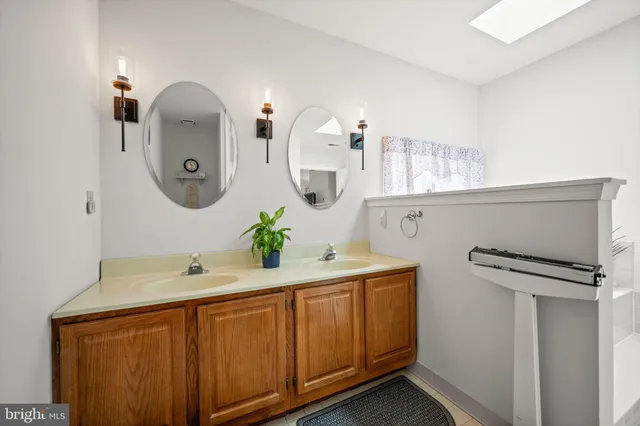 a view of a hallway with a livingroom and entryway